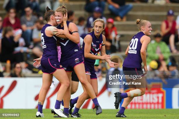 Kara Donnellan and Kellie Gibson of the Dockers celebrate a goal during the round seven AFLW match between the Fremantle Dockers and the Carlton...