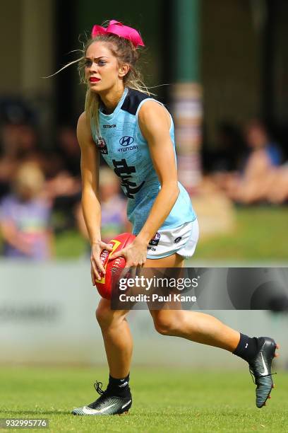 Bridie Kennedy of the Blues looks to pass the ball during the round seven AFLW match between the Fremantle Dockers and the Carlton Blues at Fremantle...