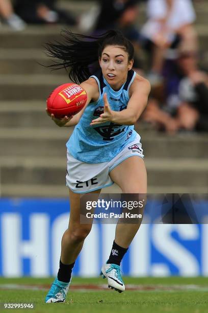 Katie-Jayne Grieve of the Blues looks to gather the ball during the round seven AFLW match between the Fremantle Dockers and the Carlton Blues at...