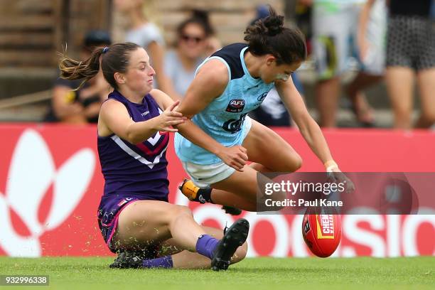 Ashley Sharp of the Dockers and Gabriella Pound of the Blues contest for the ball during the round seven AFLW match between the Fremantle Dockers and...