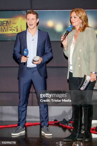 Alexander Bommes and Bettina Tietjen during the photo call to the 'Tietjen und Bommes' TV show on March 16, 2018 in Hanover, Germany.