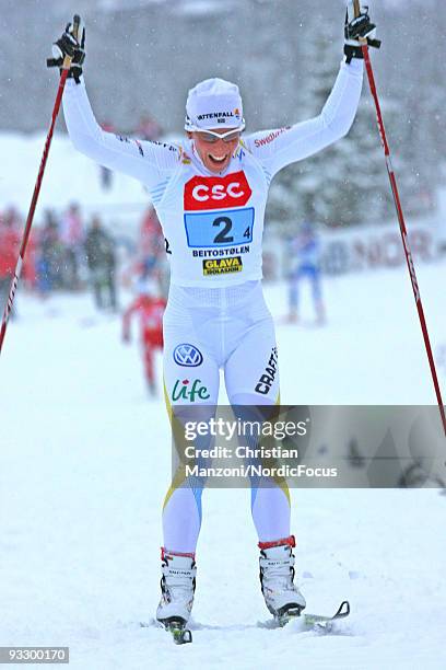 Charlotte Kalla of Sweden celebrates the victory of her team in the Women's 4x5km Cross Country Relay Skiing during day two of the FIS World Cup on...