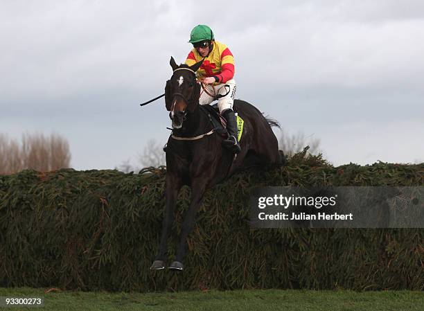 Jamie Moore and Dev clear the last fence before going on to land The totesuper7 Grand Sefton Handicap Steeple Chase Race run at Aintree Racecourse on...