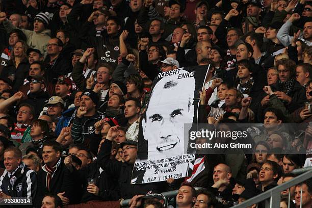 Supporters of St. Pauli hold up a placard to commemorate Robert Enke during the Second Bundesliga match between FC Augsburg and FC St. Pauli at the...