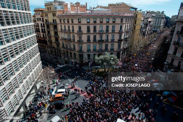 Pensioners march in Barcelona on March 17 during a protest supported by the main Spanish unions, demanding decent pensions and to defend their...