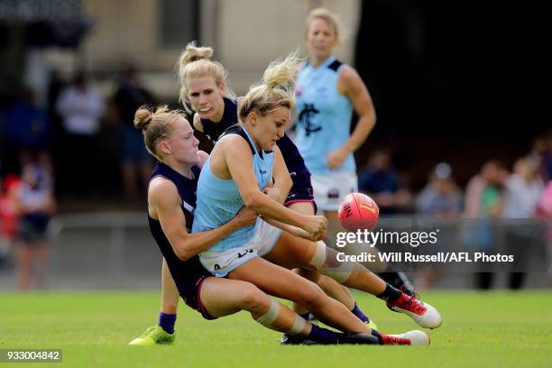 Jess Hosking of the Blues is tackled by Stephanie Cain of the Dockers during the round seven AFLW match between the Fremantle Dockers and the Carlton...