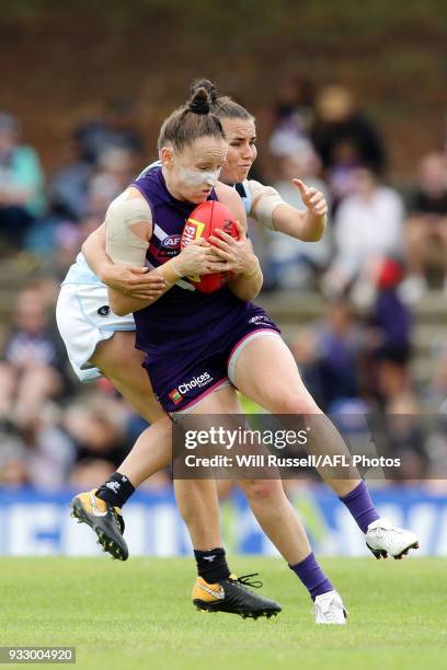 Kara Donnellan of the Dockers is tackled by Lauren Brazzale of the Blues during the round seven AFLW match between the Fremantle Dockers and the...