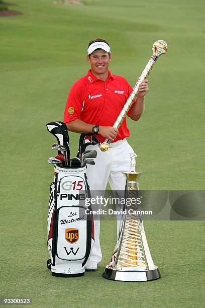 Lee Westwood of England with the Dubai World Championship and the Race to Dubai trophies after his victory in the final round of the Dubai World...