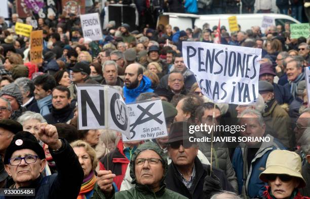 Demonstrators gather in front of Reina Sofia museum after marching in Madrid on March 17 during a protest called by the main Spanish unions and the...