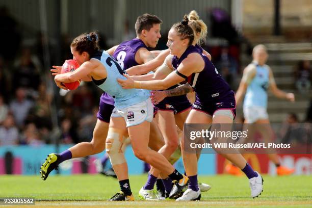 Shae Audley of the Blues marks the ball under pressure from Kara Donnellan of the Dockers during the round seven AFLW match between the Fremantle...