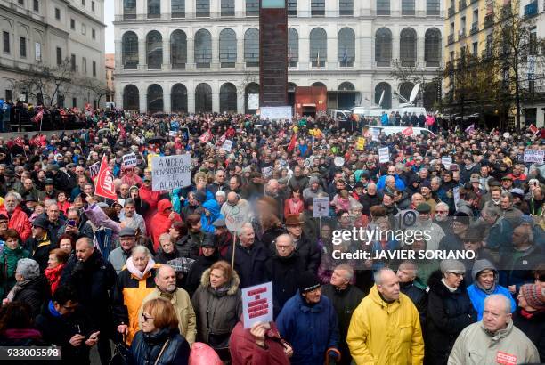 Demonstrators gather in front of Reina Sofia museum after marching in Madrid on March 17 during a protest called by the main Spanish unions and the...