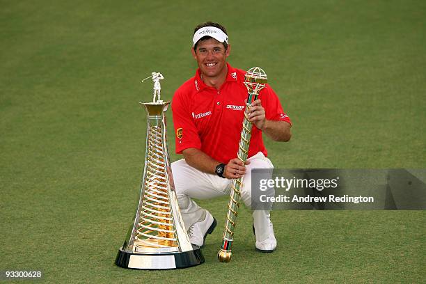 Lee Westwood of England poses with the trophy after winning the Dubai World Championship and the Race To Dubai on the Earth Course, Jumeirah Golf...