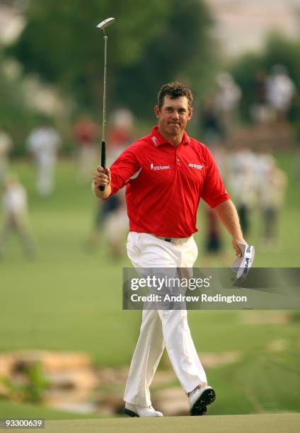 Lee Westwood of England waves to the crowd on the 18th hole on his way to victory in the Dubai World Championship and the Race To Dubai on the Earth...