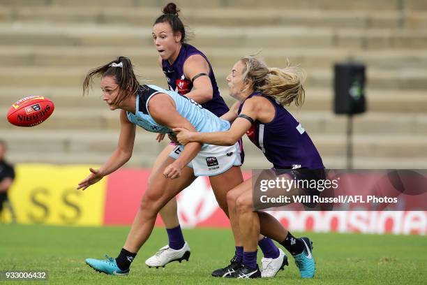 Nicola Stevens of the Blues is tackled by Lisa Webb of the Dockers during the round seven AFLW match between the Fremantle Dockers and the Carlton...