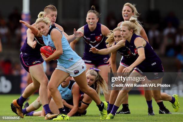 Sarah Hosking of the Blues is tackled by Tayla McAuliffe of the Dockers during the round seven AFLW match between the Fremantle Dockers and the...