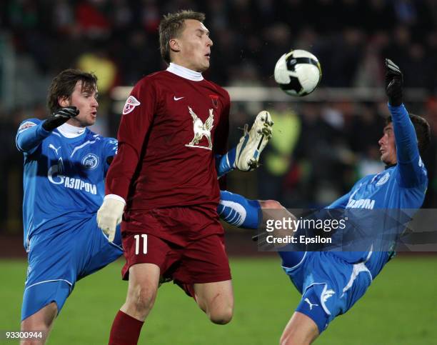 Alexander Bukharov of FC Rubin Kazan battles for the ball with Nicolas Lombaerts and Ivica Krizhanac of Zenit, St. Petersburg during the Russian...