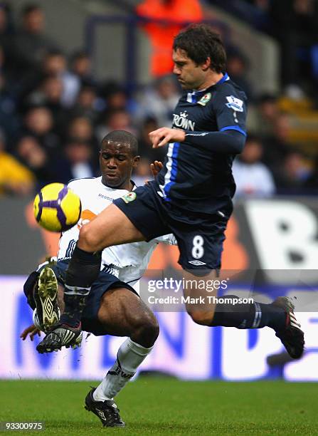 Fabrice Muamba of Bolton Wanderers tangles with David Dunn of Blackburn Rovers during the Barclays Premier League match between Bolton Wanderers and...