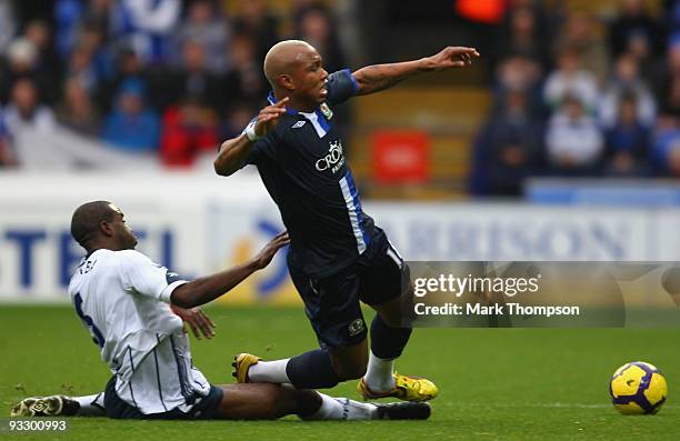 Fabrice Muamba of Bolton Wanderers tangles with El Hadji Diouf of Blackburn Rovers during the Barclays Premier League match between Bolton Wanderers...