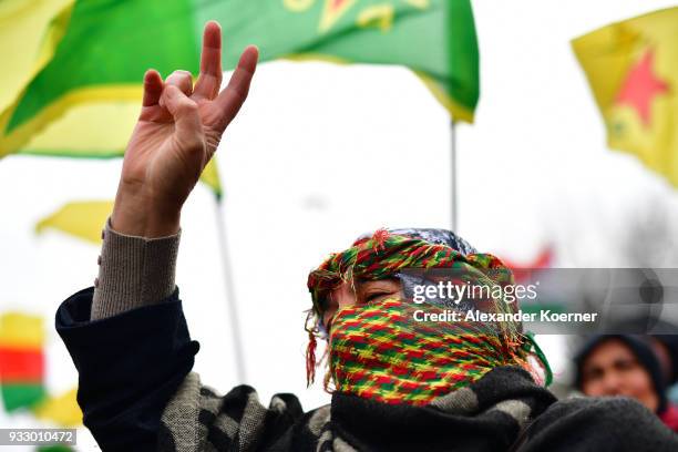 Expatriate Kurds shout slogans against Turkish President Recep Tayyip Erdogan as they participate in celebrations marking the Kurdish new year, or...