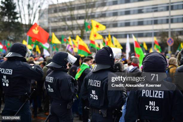 Police forces secure Kurds as they participate in celebrations marking the Kurdish new year, or Newroz, on March 17, 2018 in Hanover, Germany. Many...