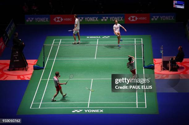 Indonesia's Marcus Fernaldi Gideon and Kevin Sanjaya Sukamuljo celebrate beating Denmark's Mads Conrad-Petersen and Mads Pieler Kolding during their...