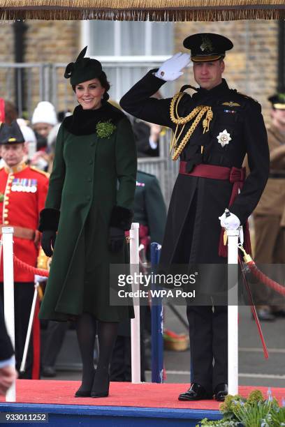 Catherine, Duchess of Cambridge and Prince William, Duke Of Cambridge stand on the dias during the annual Irish Guards St Patrick's Day Parade at...