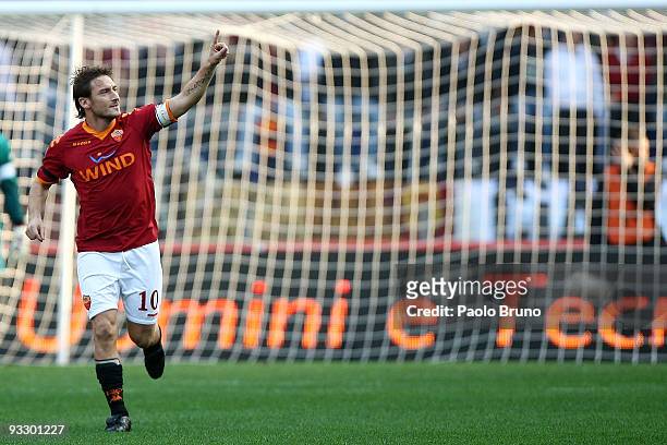 Francesco Totti of AS Roma celebrates scoring his teams opening goal during the Serie A match between Roma and Bari at Stadio Olimpico on November...