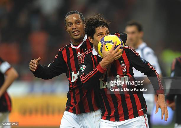 Marco Borriello of Milan celebrates with Ronaldinho after scoring their second goal during the Serie A match between Milan and Cagliari at Stadio...