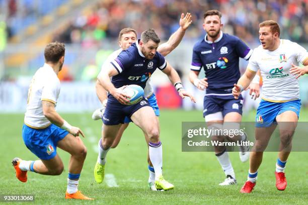 Tommy Seymour of Scotland is tackled by Tommaso Benvenuti of Italy during the NatWest Six Nations match between Italy and Scotland at Stadio Olimpico...