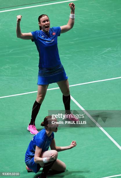Denmark's Kamilla Rytter Juhl and Christinna Pedersen celebrate beating Japan's Mayu Matsumoto and Wakana Nagahara during their women's doubles...