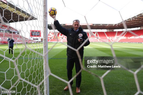 Referee Martin Atkinson tests the goal line technology prior to the Premier League match between Stoke City and Everton at Bet365 Stadium on March...