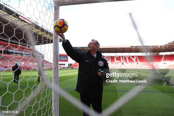 Referee Martin Atkinson tests the goal line technology prior to the Premier League match between Stoke City and Everton at Bet365 Stadium on March...