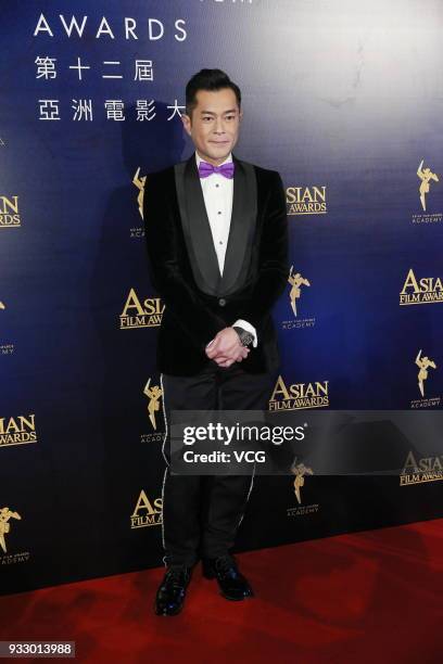 Actor Louis Koo poses on the red carpet of the 12th Asian Film Awards at the Venetian Hotel on March 17, 2018 in Macao, China.