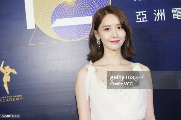 South Korean singer Im Yoona poses on the red carpet of the 12th Asian Film Awards at the Venetian Hotel on March 17, 2018 in Macao, China.