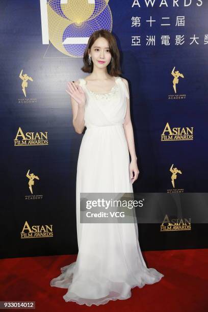 South Korean singer Im Yoona poses on the red carpet of the 12th Asian Film Awards at the Venetian Hotel on March 17, 2018 in Macao, China.