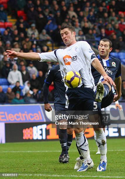 Gary Cahill of Bolton Wanderers tangles with Brett Emerton of Blackburn Rovers during the Barclays Premier League match between Bolton Wanderers and...