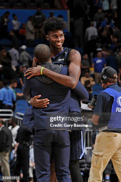 Jonathan Isaac of the Orlando Magic greets Kyrie Irving of the Boston Celtics after the game on March 16, 2018 at Amway Center in Orlando, Florida....