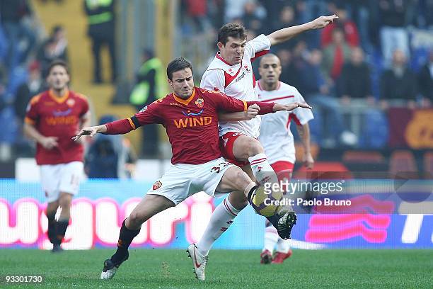 Matteo Brighi of AS Roma and Vitalli Kutuzov of AS Bari in action during the Serie A match between Roma and Bari at Stadio Olimpico on November 22,...