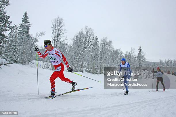 Ivan Babikov of Canada, Vassilii Rotchev of Russia and Axel Teichmann of Germany compete in the Men's 4x10km Cross Country Relay Skiing during day...
