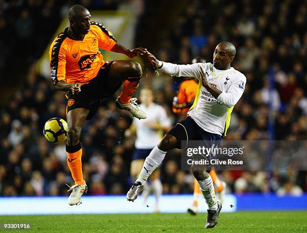 Jermain Defoe of Tottenham Hotspur is challenged by Emmerson Boyce of Wigan Athletic during the Barclays Premier League match between Tottenham...