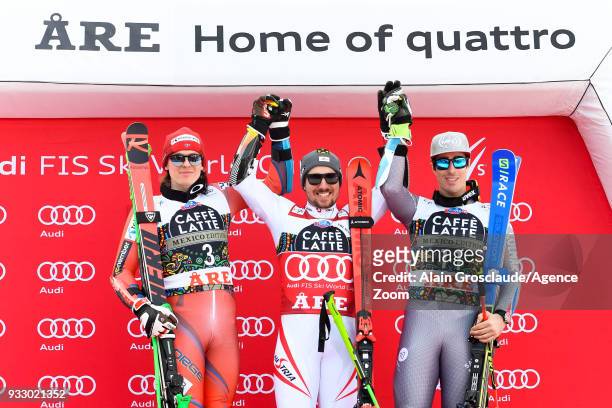 Henrik Kristoffersen of Norway takes 2nd place, Marcel Hirscher of Austria takes 1st place, Victor Muffat-jeandet of France takes 3rd place during...