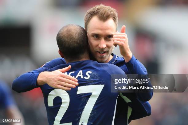 Christian Eriksen of Tottenham Hotspur celebrates scoring his 2nd goal with Lucas Moura during the Emirates FA Cup Quarter Final match between...