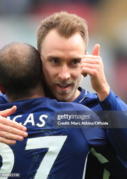 Christian Eriksen of Tottenham Hotspur celebrates scoring his 2nd goal with Lucas Moura during the Emirates FA Cup Quarter Final match between...