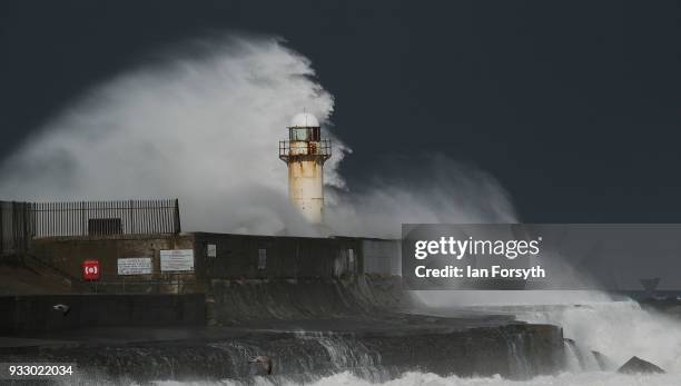 Huge waves crash against the seawall and lighthouse at South Gare near Redcar on March 17, 2018 in Redcar, England. Further bad weather has arrived...