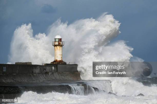 Huge waves crash against the seawall and lighthouse at South Gare near Redcar on March 17, 2018 in Redcar, England. Further bad weather has arrived...