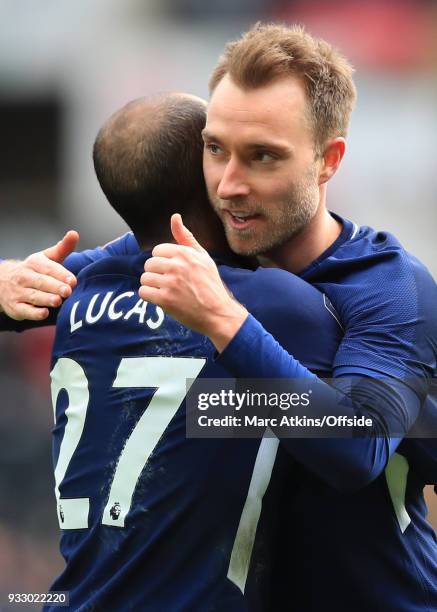 Christian Eriksen of Tottenham Hotspur celebrates scoring his 2nd goal with Lucas Moura during the Emirates FA Cup Quarter Final match between...