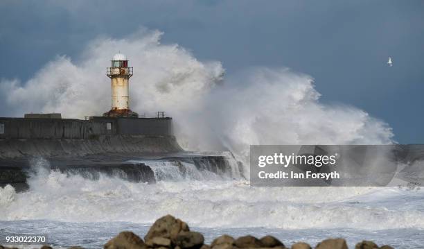 Huge waves crash against the seawall and lighthouse at South Gare near Redcar on March 17, 2018 in Redcar, England. Further bad weather has arrived...