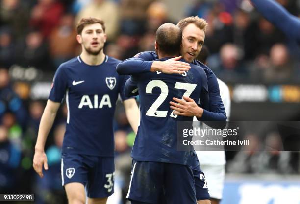 Christian Eriksen of Tottenham Hotspur celebrates with teammate Lucas Moura after scoring his sides third goal during The Emirates FA Cup Quarter...