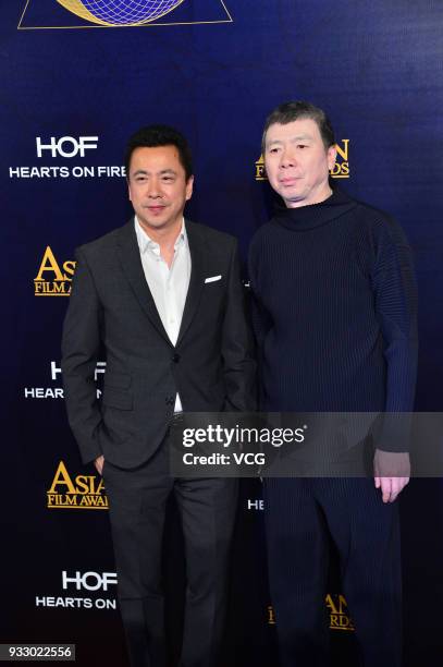 Director Feng Xiaogang and Huayi Brothers Media Corp. CEO Wang Zhonglei pose on the red carpet of the 12th Asian Film Awards at the Venetian Hotel on...