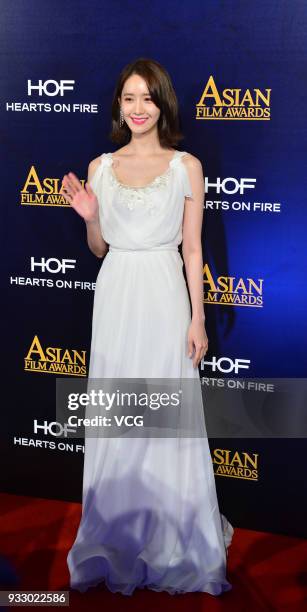 South Korean actress and singer Im Yoona poses on the red carpet of the 12th Asian Film Awards at the Venetian Hotel on March 17, 2018 in Macao,...
